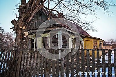 Not residential half-ruined wooden house on the outskirts of the village Stock Photo