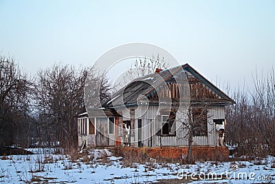 Not residential half-ruined wooden house on the outskirts of the village Stock Photo