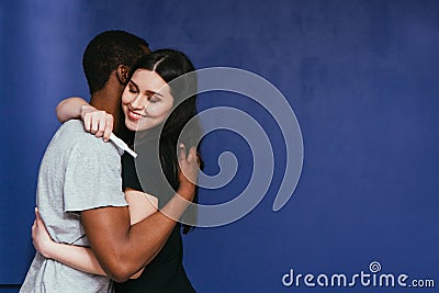 We are not pregnant. Happy couple hug with relief. Stock Photo