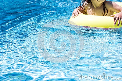 Not recognizable toddler child in a swimming pool Stock Photo