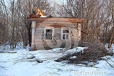 Not residential half-ruined wooden house on the outskirts of the village Stock Photo