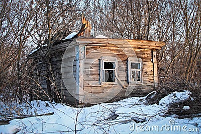 Not residential half-ruined wooden house on the outskirts of the village Stock Photo