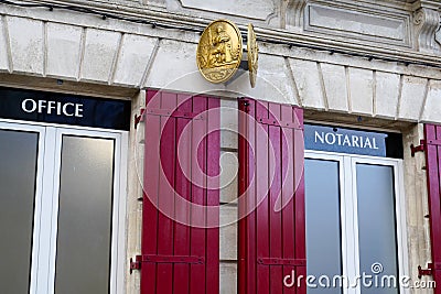 Notaire french sign gold on wall above entrance to the notary office Editorial Stock Photo