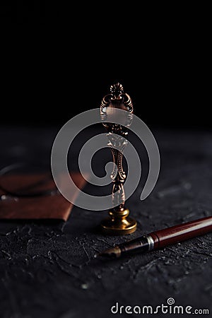 Notarized document with seal, glasess and pen. Legality concept. Vertical image Stock Photo