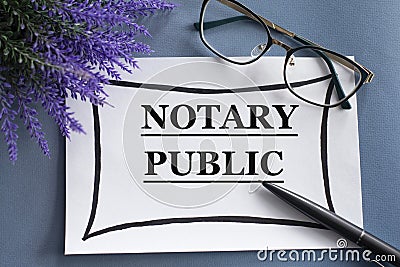 NOTARY PUBLIC - word on a white sheet against the background of glasses, pens and lavender Stock Photo