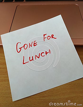 note left on laptop Gone For Lunch Stock Photo