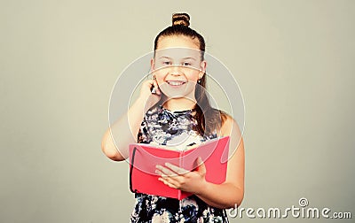 Note secrets down in cute girly diary journal. Keeping secrets here. Keeping her secrets in diary. Child cute girl hold Stock Photo