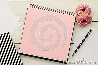 Open notebook and donuts Stock Photo