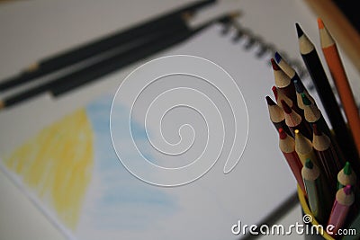 Notebook blank page, colorful pencils Stock Photo