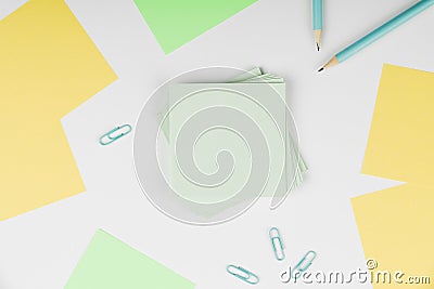 Notebook and Colored Papers Stickers Lying On White Desk. Multiple Assorted Collection Office Stationery. Photo With Stock Photo