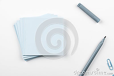 Notebook and Colored Papers Stickers Lying On White Desk. Multiple Assorted Collection Office Stationery. Photo With Stock Photo