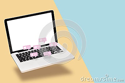 Notebook computer laptop with blank white screen with notification icons from social media interactions with friend in social Stock Photo