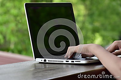 Notebook computer For working online Via internet Is a device that requires On a natural Stock Photo