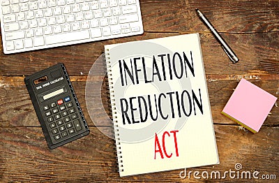 notebook with Inflation Reduction Act concept near calculator and keyboard Stock Photo