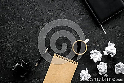 Notebook, ink, dip pen, coffee for writer workplace set on black office background top view mock-up Stock Photo