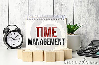 notebook near the calculator text on white paper time management Stock Photo