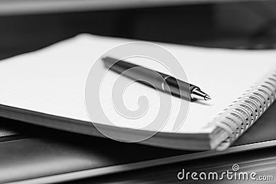 Notebook and pen. Black and white. Stock Photo