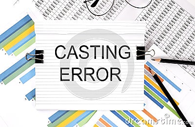 Notebook with pencils, glasses on the graph background, with text CASTING ERROR Stock Photo