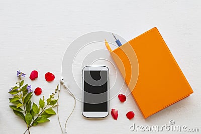 Notebook planner with mobile phone for business work arrangement flat lay style Stock Photo