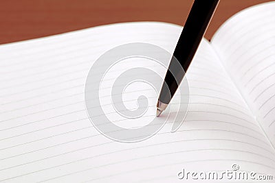 Notebook with recycle paper and ball point pen on work table. Copy space for text, macro close up background Stock Photo