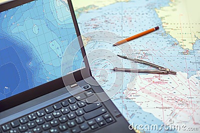 Notebook screen with sea map and mavigation tools Stock Photo