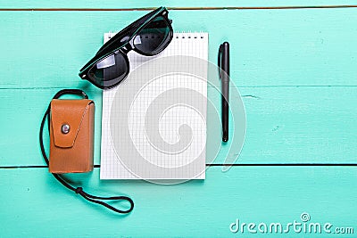 Notebook, shoes, camera Stock Photo