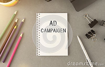 Notebook with Toolls and Notes about Ad Campaign Stock Photo