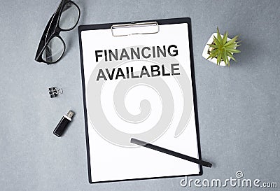 Toolls and Notes about Marketing. FINANCING AVAILABLE text Stock Photo