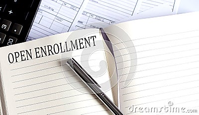 Notebook with Toolls and Notes about OPEN ENROLLMENT Stock Photo