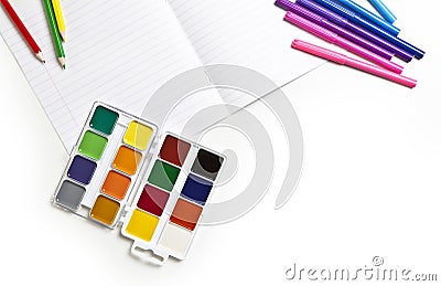 Watercolors, pencils, markers and notebook on a white background Stock Photo