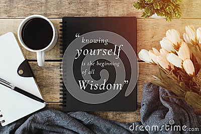 Notebook with wisdom quote. Stock Photo