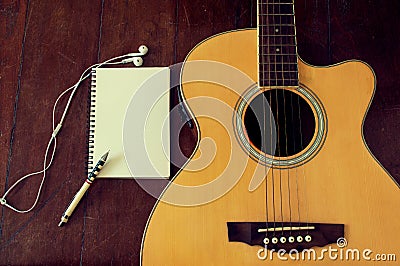 Notebook and wooden pencil on guitar Stock Photo