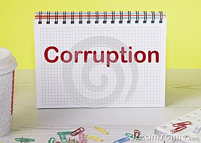 a notebook with the word Corruption. A Conceptual Image. Black and white. Fight against corruption Stock Photo