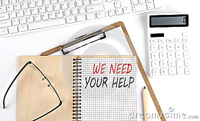 Notebook with the word NEED YOUR HELP with keyboard and calculator on the white background Stock Photo