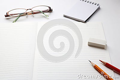 Notebook and writing utensils Stock Photo