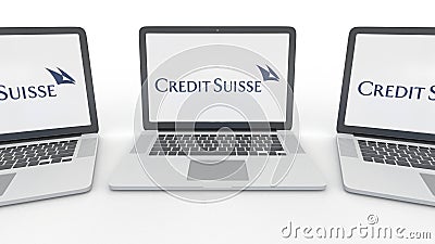 Notebooks with Credit Suisse Group logo on the screen. Computer technology conceptual editorial 3D rendering Editorial Stock Photo