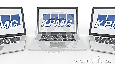 Notebooks with KPMG logo on the screen. Computer technology conceptual editorial 3D rendering Editorial Stock Photo