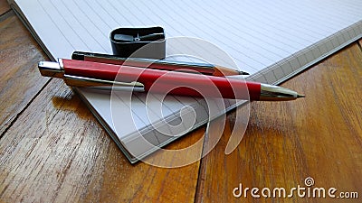 Notebooks, pens and pencils on wooden Stock Photo