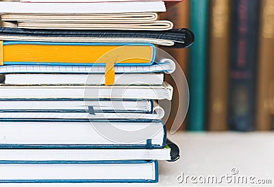 Notebooks piles, stack of books education back to school background with copy space for text Stock Photo