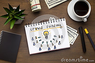 Notepad with crowdfunding concept laying on office table Stock Photo