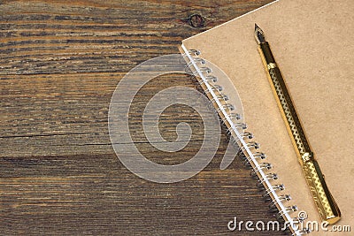 Notepad With Gold Fountain Pen On The Old Wood Table Stock Photo