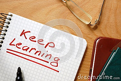 Notepad with keep learning. Stock Photo