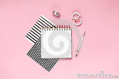 Notepad and notebooks with stationery. Golden, white, pink and black stationery back to school concept. Top horizontal view Stock Photo