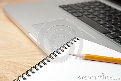 Notepad Pencil and Computer Laptop Editorial Stock Photo