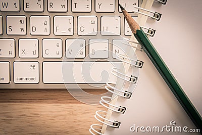 Notepad Pencil and Computer Laptop Editorial Stock Photo