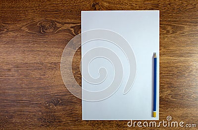 Notepad and pencil on wood table Stock Photo