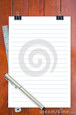 Notepad, ruler and pen on desk Stock Photo