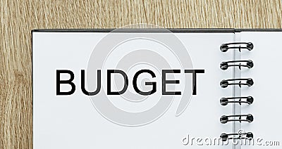 Notepad with text Budget on wooden deskt. Business and finance concept Stock Photo