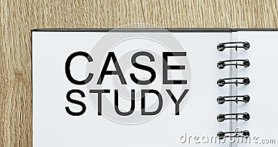 Notepad with text Case Study on wooden deskt. Business and finance concept Stock Photo