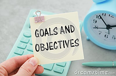Text Goals and Objectives on wooden deskt. Business and finance concept Stock Photo